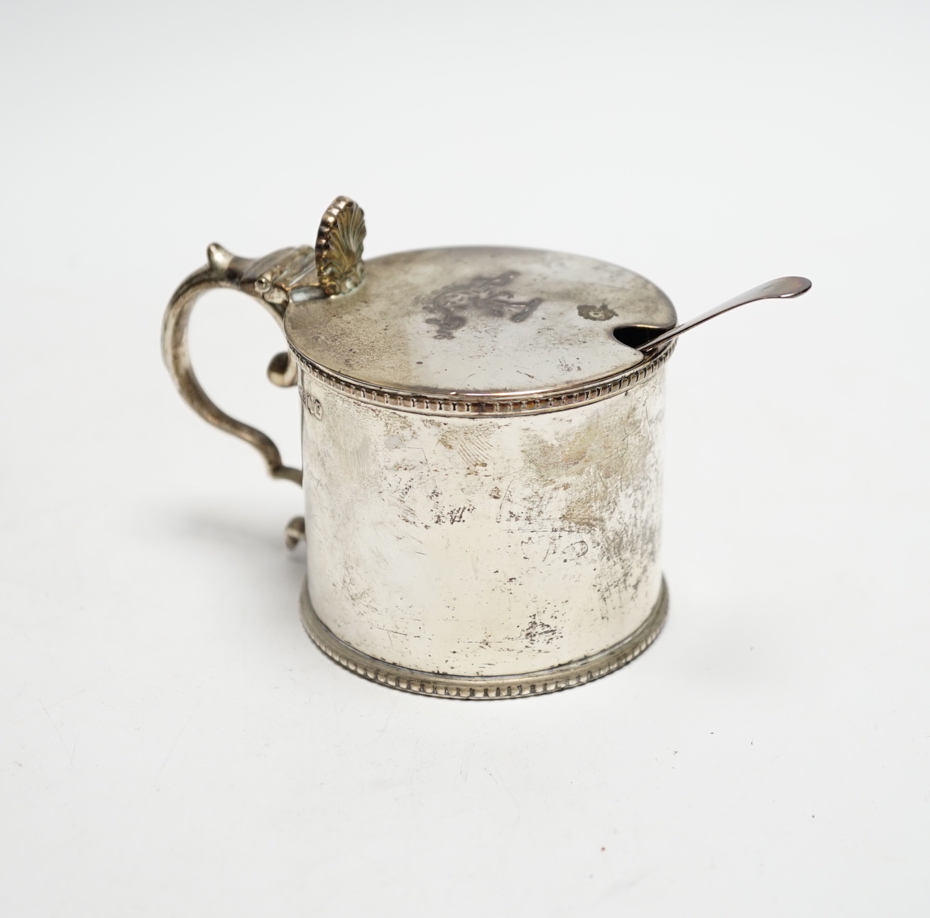 A Victorian Scottish silver drum mustard, James McKay, Edinburgh, 1861, height 72mm, with an earlier associated silver spoon